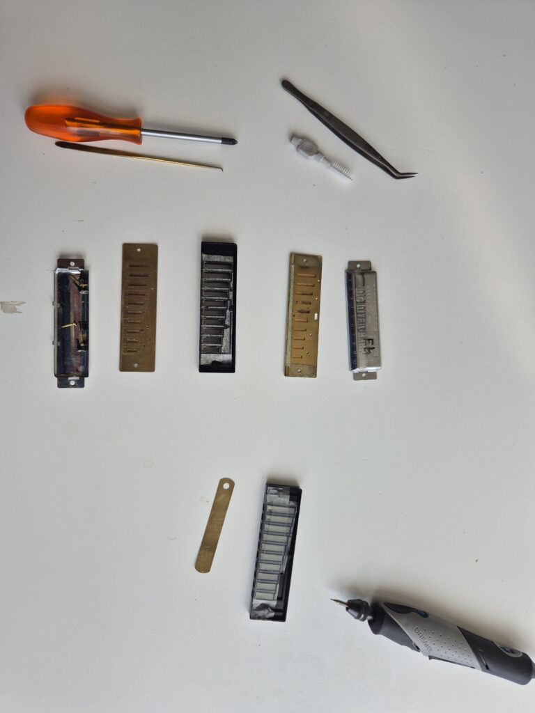 Disassembled MS Big River and (below) a comb with tape on the upper side